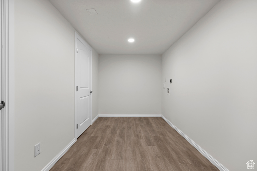 Unfurnished room featuring wood finished floors and recessed lighting
