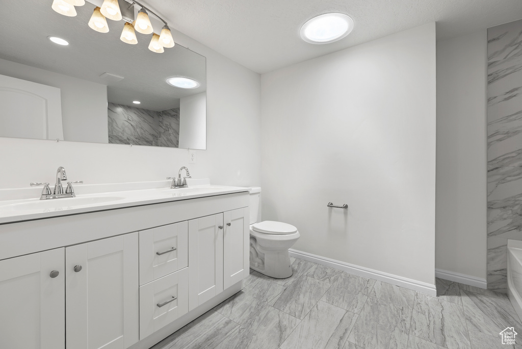 Bathroom featuring marble finish flooring, double vanity, a shower, and a bath