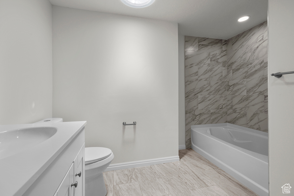 Full bathroom with vanity, bathing tub / shower combination, and recessed lighting