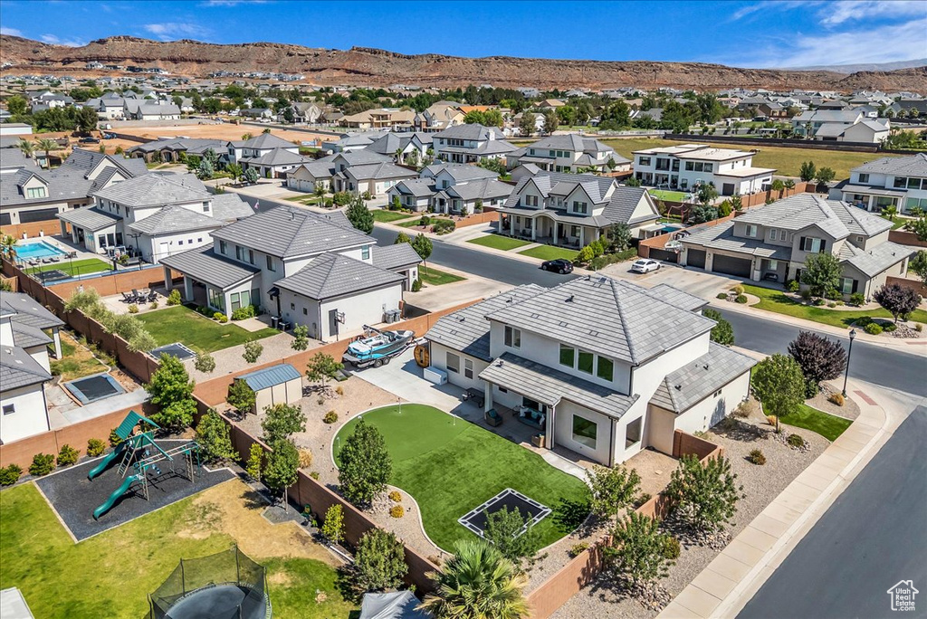 Aerial perspective of suburban area with a mountain backdrop