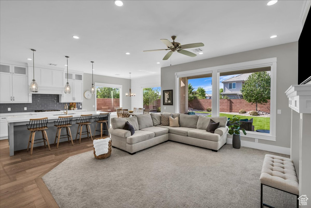 Living room featuring recessed lighting, wood finished floors, and a ceiling fan