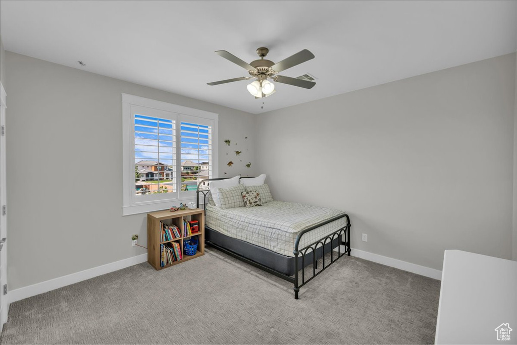 Bedroom with carpet and a ceiling fan