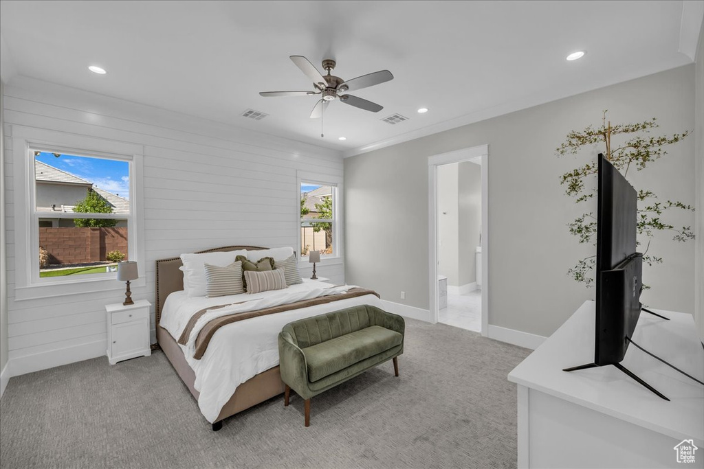 Bedroom featuring light carpet, recessed lighting, ceiling fan, and connected bathroom