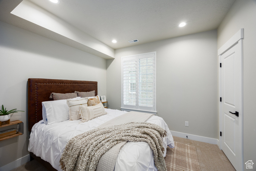 Carpeted bedroom featuring baseboards and recessed lighting