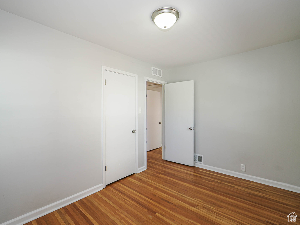 Unfurnished room with light wood finished floors