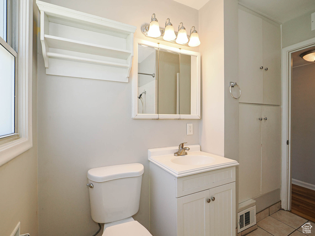 Bathroom with vanity and tile patterned flooring