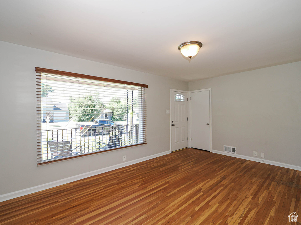 Entrance foyer with wood finished floors and baseboards