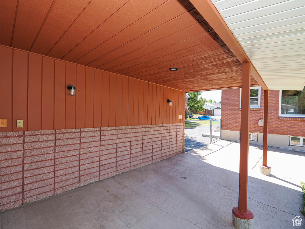 View of patio with a carport