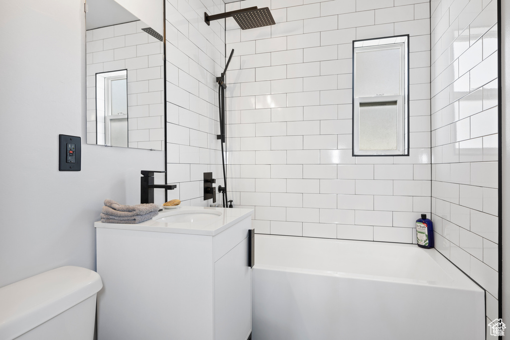 Full bathroom with vanity and shower / washtub combination