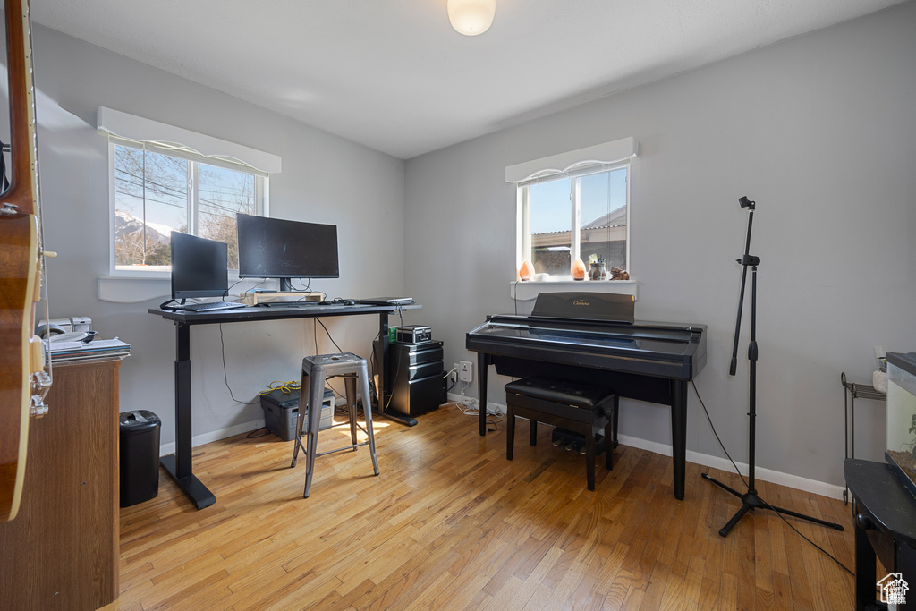 Office area with wood-type flooring and baseboards