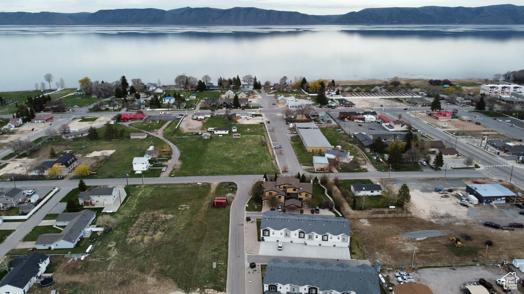 View of property location with a water and mountain view