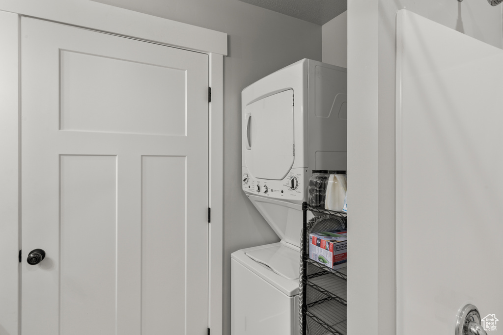 Washroom with stacked washing machine and dryer
