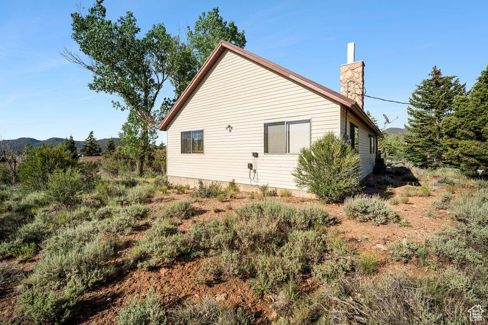 View of home's exterior featuring a chimney