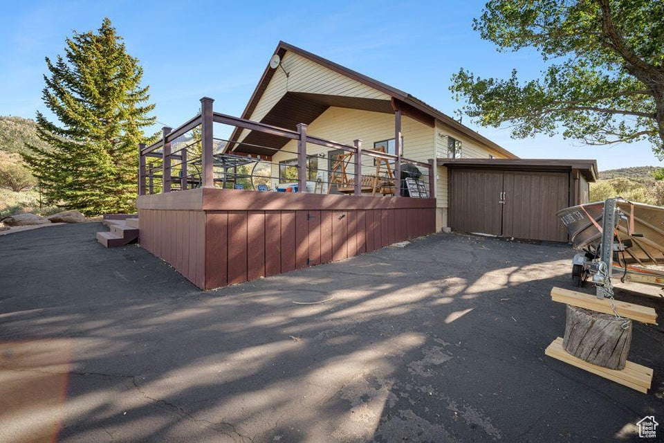 View of home's exterior with a storage unit