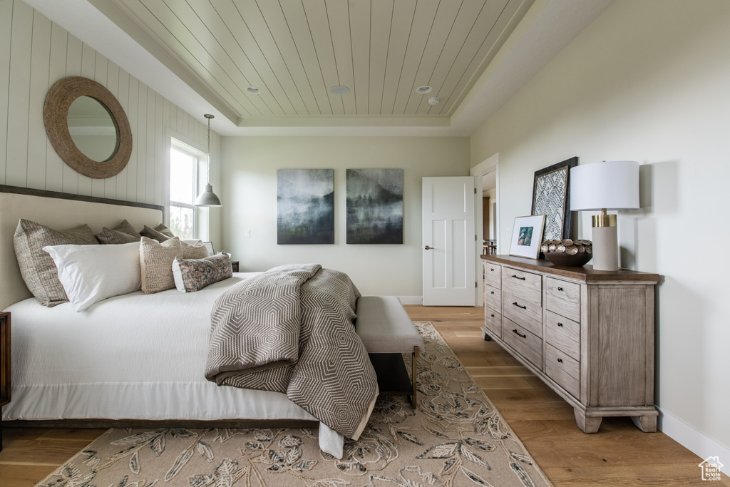 Bedroom with wood finished floors and wooden ceiling