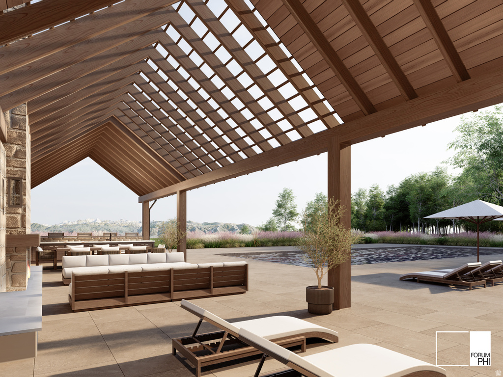 Expansive outdoor living area featuring a vaulted wood pergola with an open-slat roof