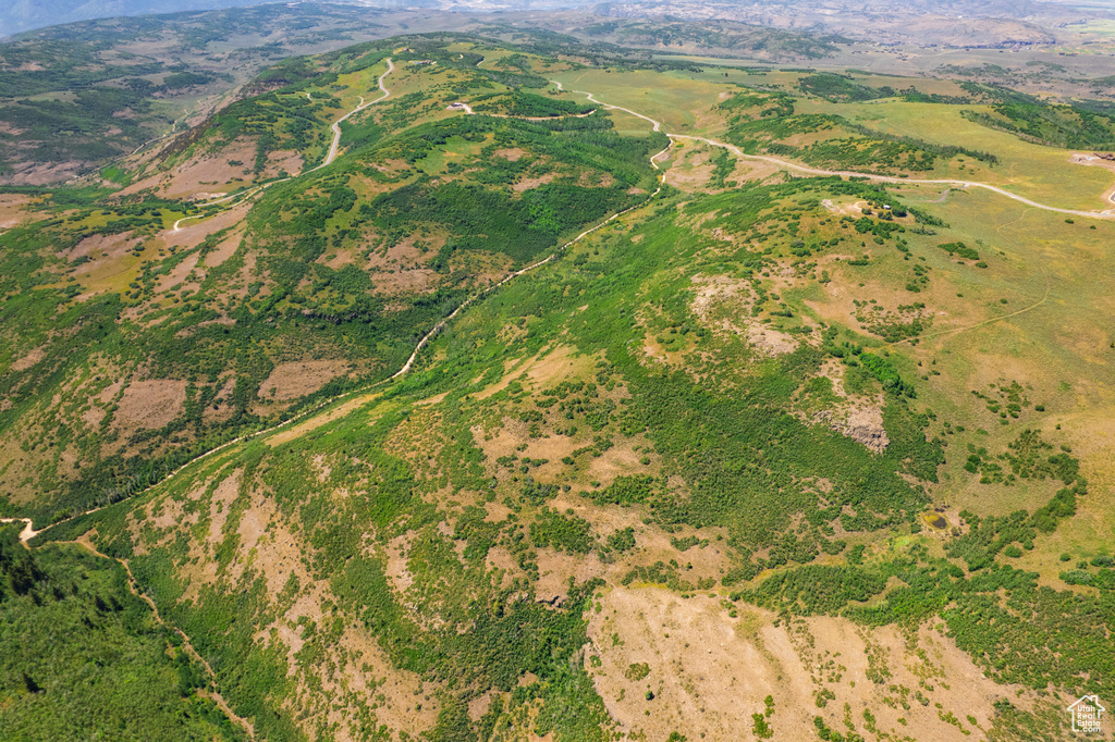 Aerial overview of property's location featuring a mountainous background