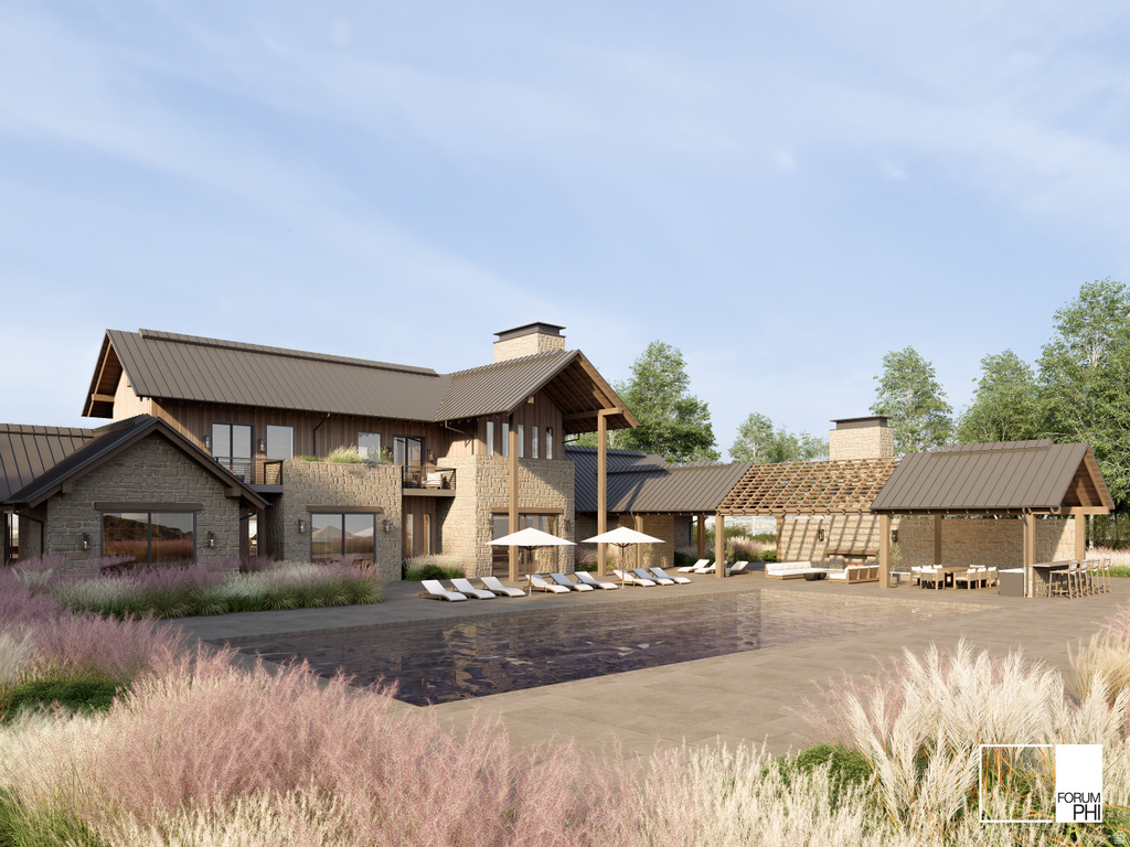 Expansive outdoor living area featuring a dark-tiled swimming pool, a large stone patio, and a covered pergola