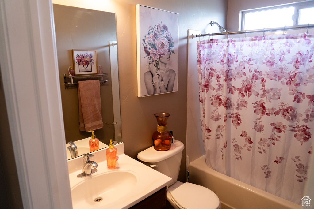 Full bathroom with vanity and shower / tub combo