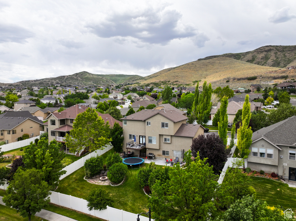 Aerial view of residential area with a mountainous background