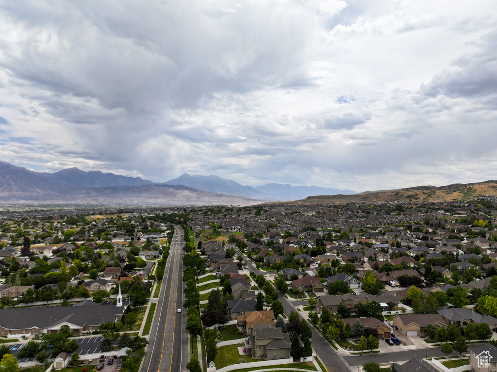 Aerial perspective of suburban area with a mountainous background