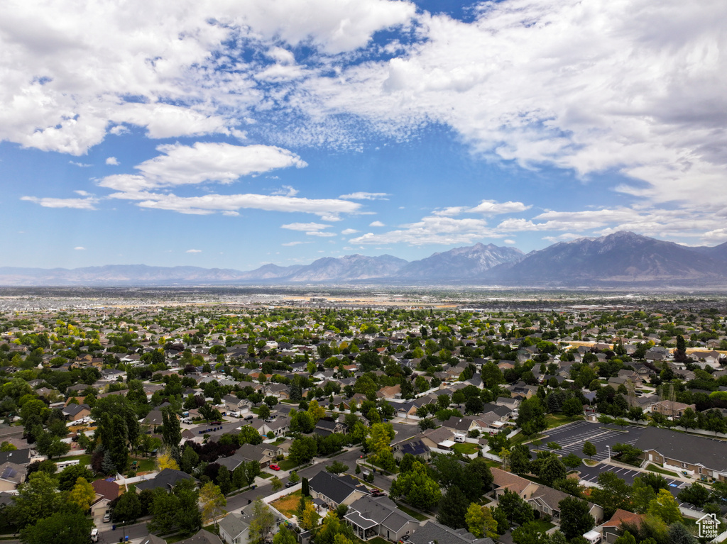 Aerial view of residential area featuring a mountain backdrop