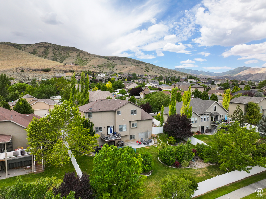 Aerial view of residential area with a mountainous background