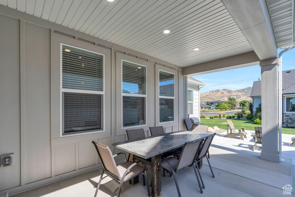 View of patio / terrace with a mountain view and outdoor dining area