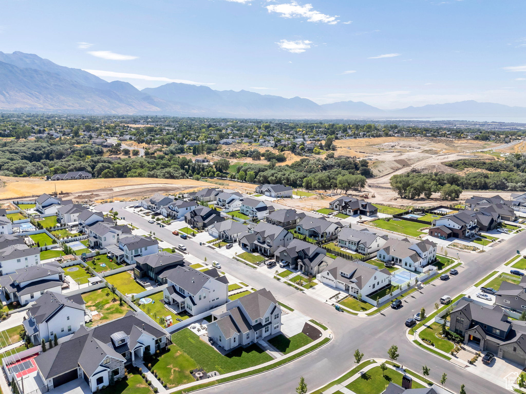 Aerial view of residential area featuring a mountainous background