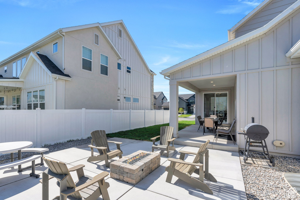 View of patio featuring a fire pit and outdoor dining space
