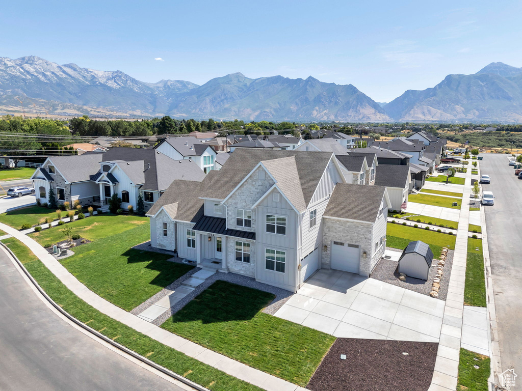 Aerial view of residential area featuring mountains