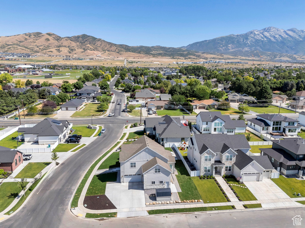 Aerial view of residential area featuring mountains