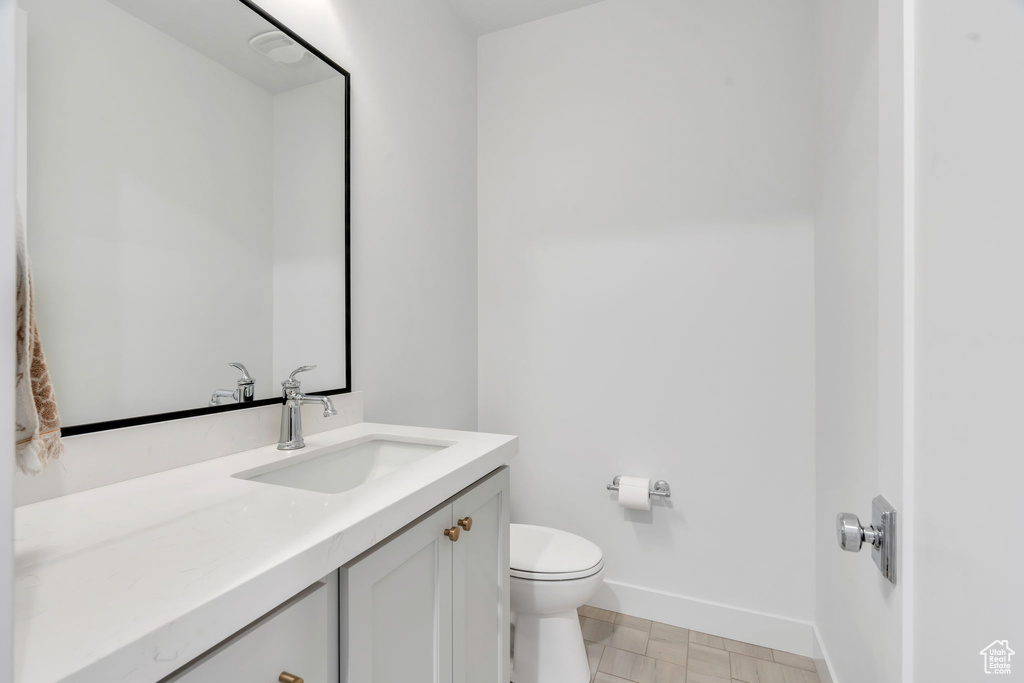 Bathroom with toilet and vanity
