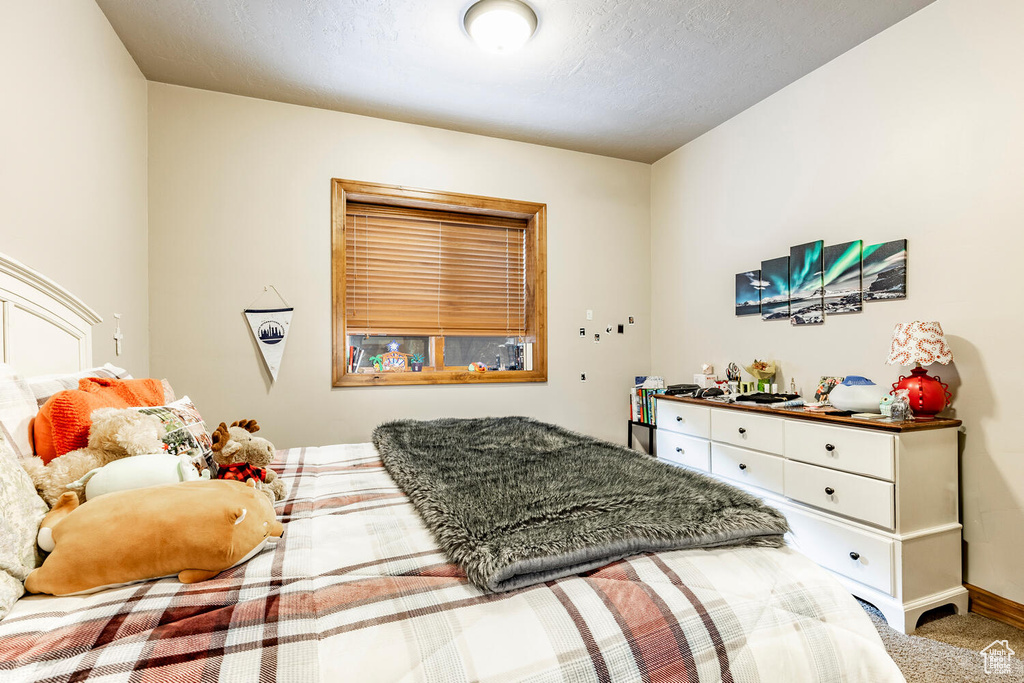 Bedroom featuring carpet flooring