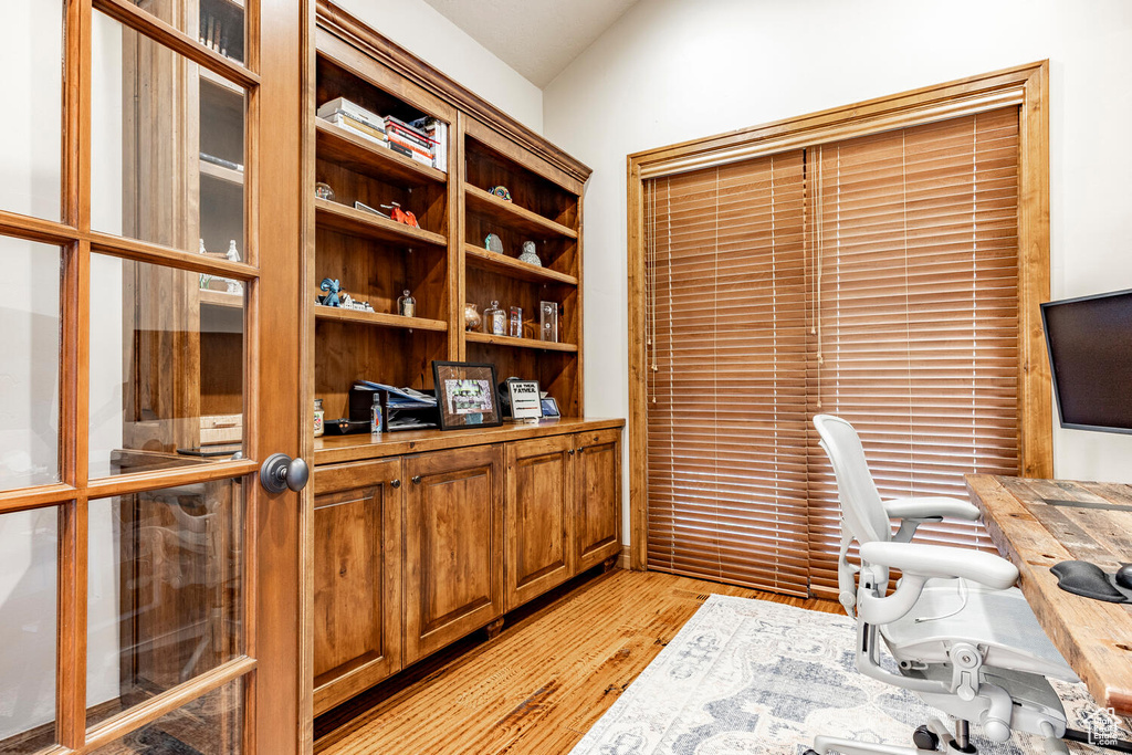 Office space with light wood finished floors