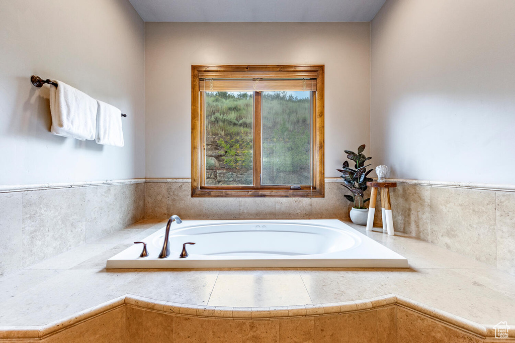 Full bathroom with a bath