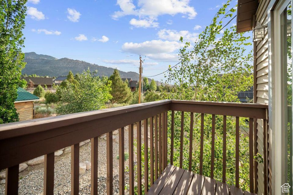 Wooden deck featuring a mountain view