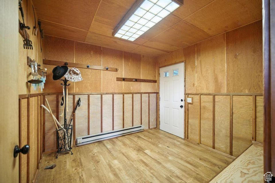 Storage room featuring a baseboard radiator