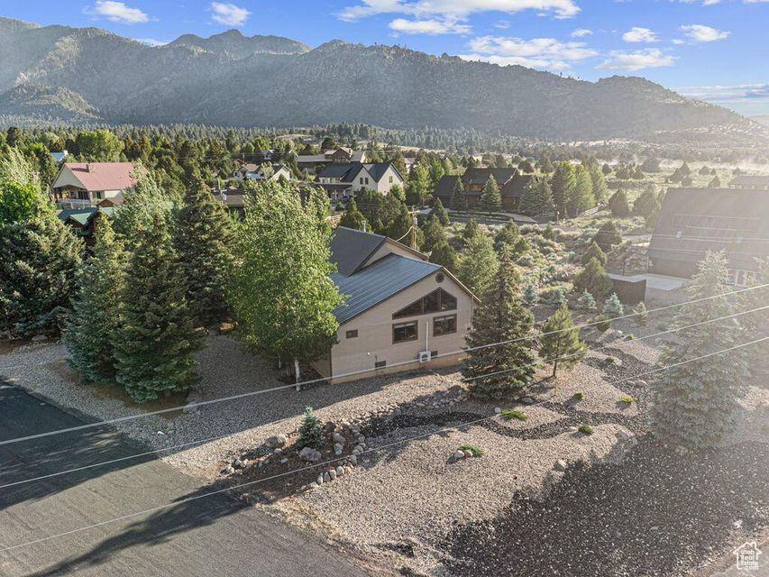 View of mountain backdrop featuring nearby suburban area