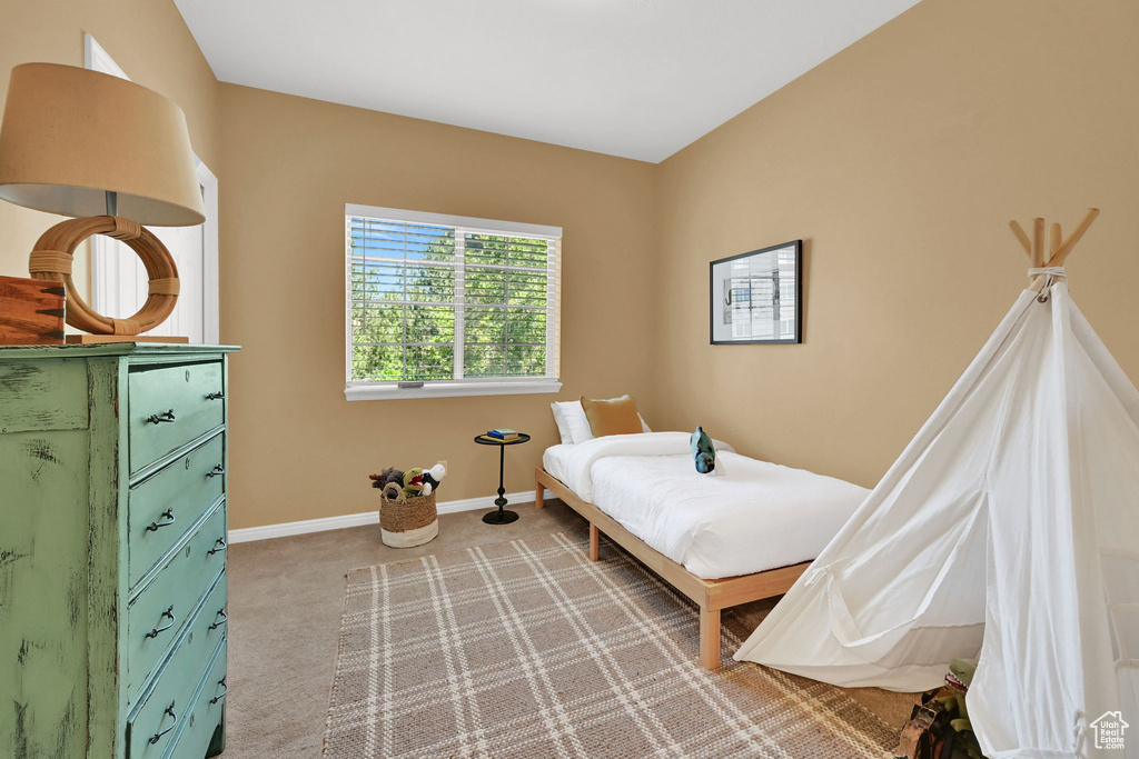 Bedroom with carpet and baseboards