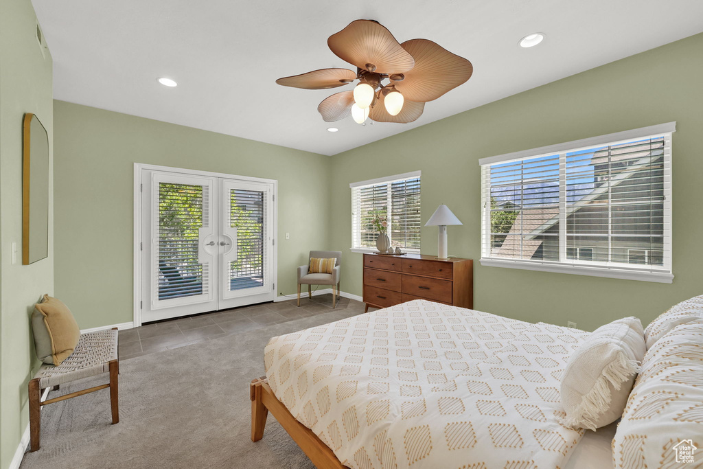 Carpeted bedroom featuring access to outside, french doors, recessed lighting, ceiling fan, and tile patterned floors