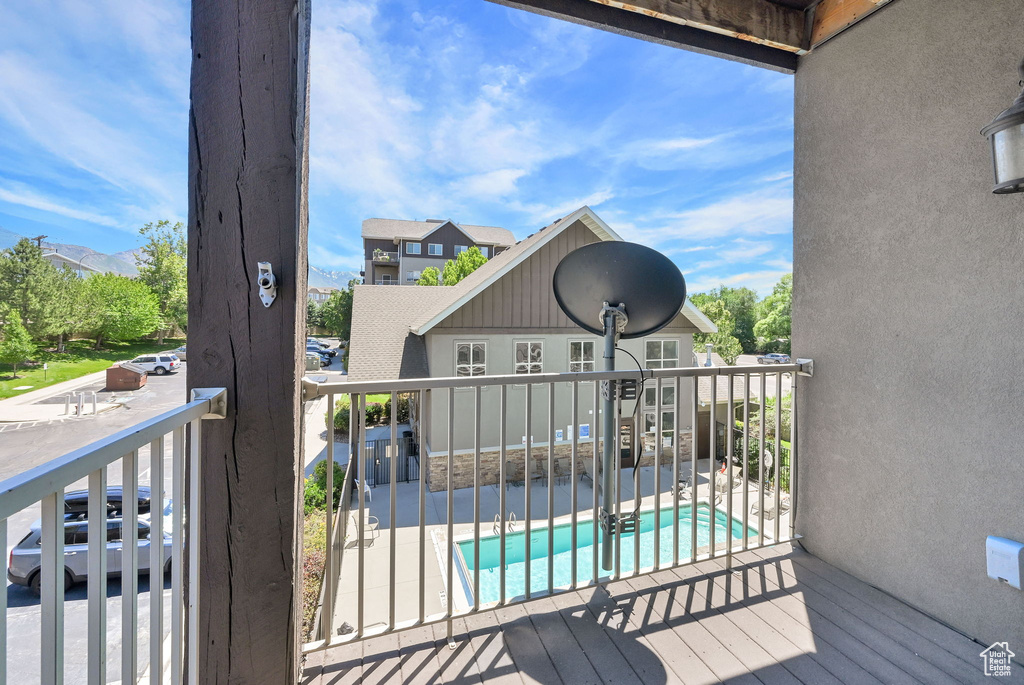 Deck featuring a community pool