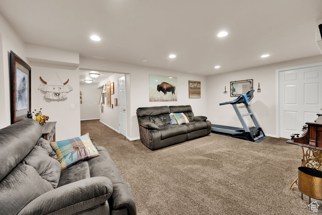 Living room featuring carpet flooring and recessed lighting