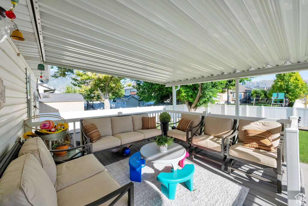 View of patio with an outdoor hangout area