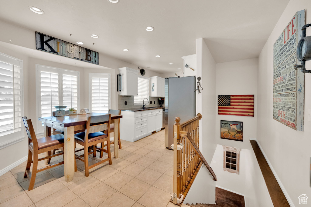 Dining room featuring recessed lighting and light tile patterned floors