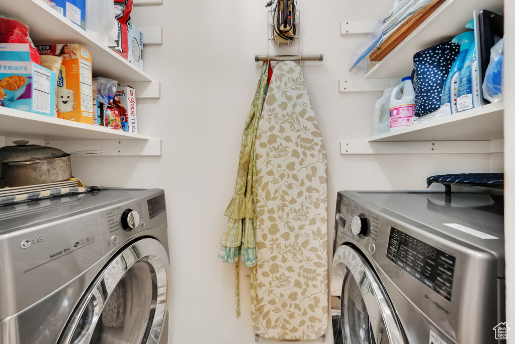 Washroom featuring independent washer and dryer