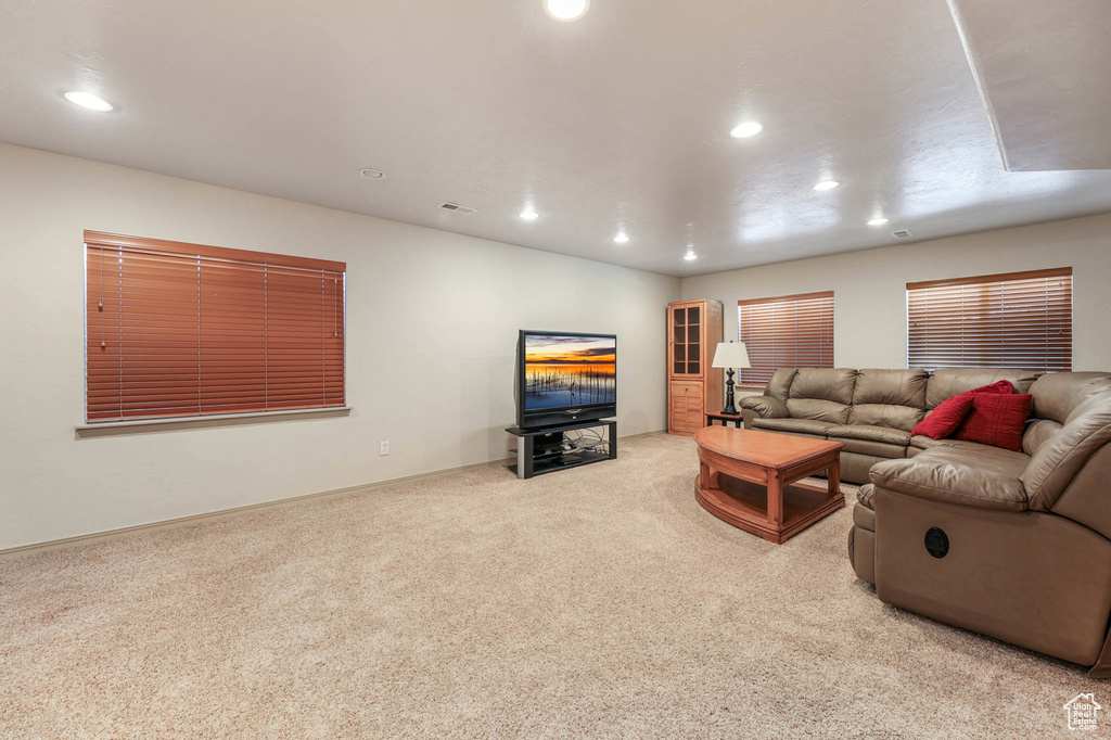 Living room featuring carpet and recessed lighting