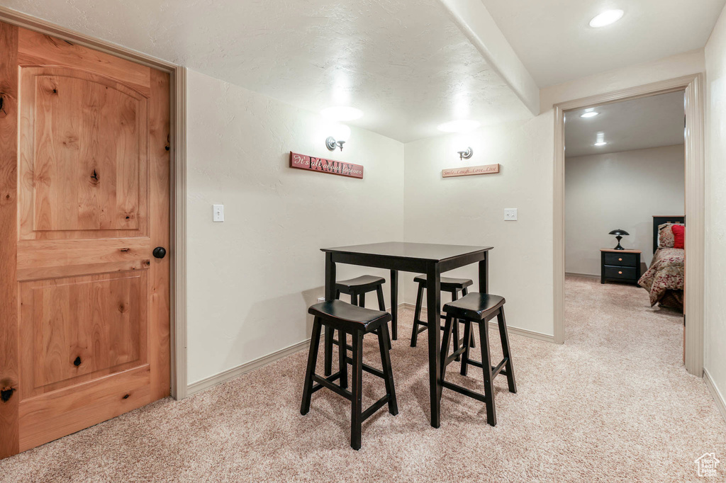 Dining room featuring light carpet and recessed lighting