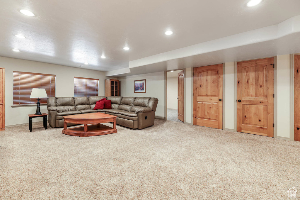 Carpeted living area featuring recessed lighting