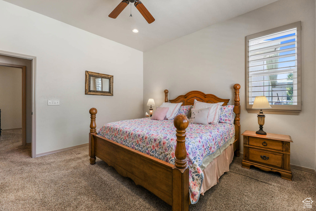 Carpeted bedroom featuring ceiling fan and recessed lighting